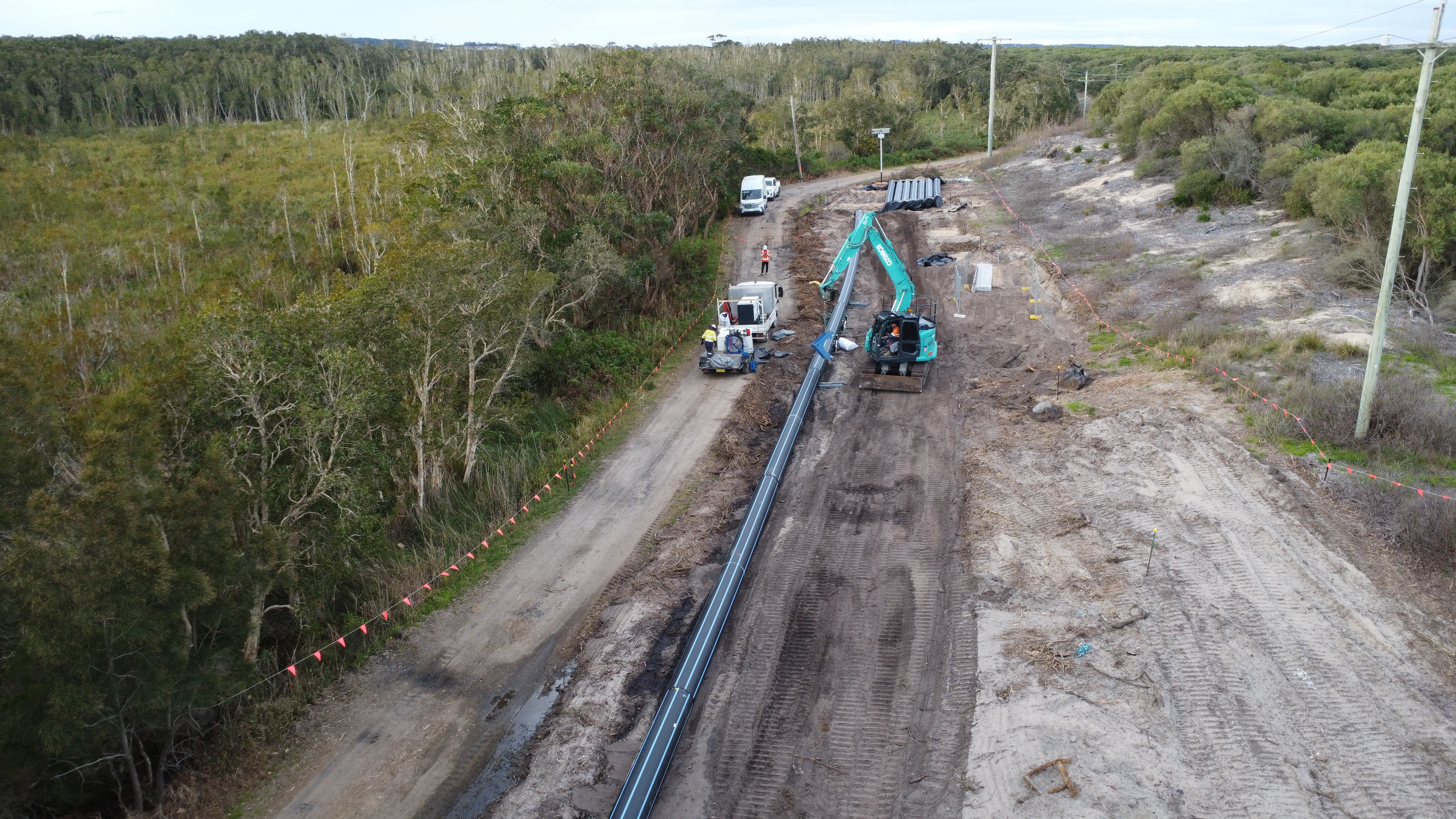 Excavating the ground and constructing a new water main in Kalaroo Fire Trail
