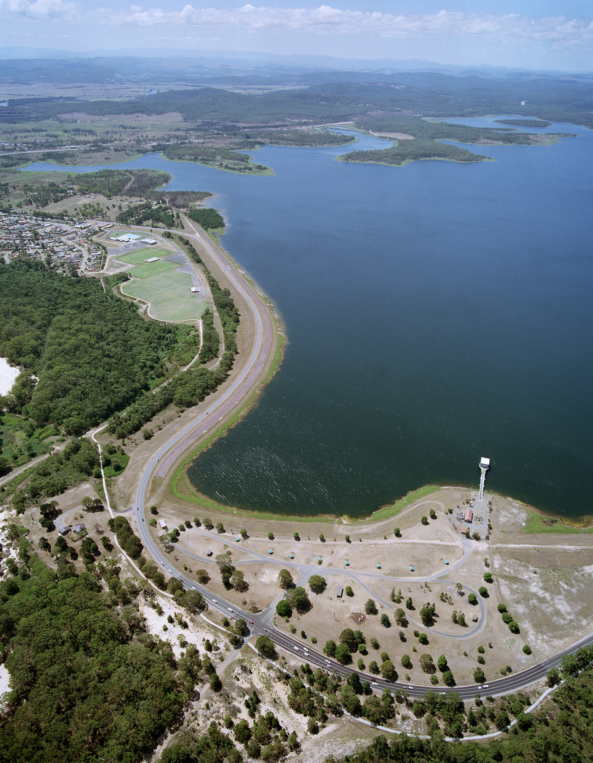 Aerial photo of Grahamstown Dam showing water and constructed embankment (dam wall).