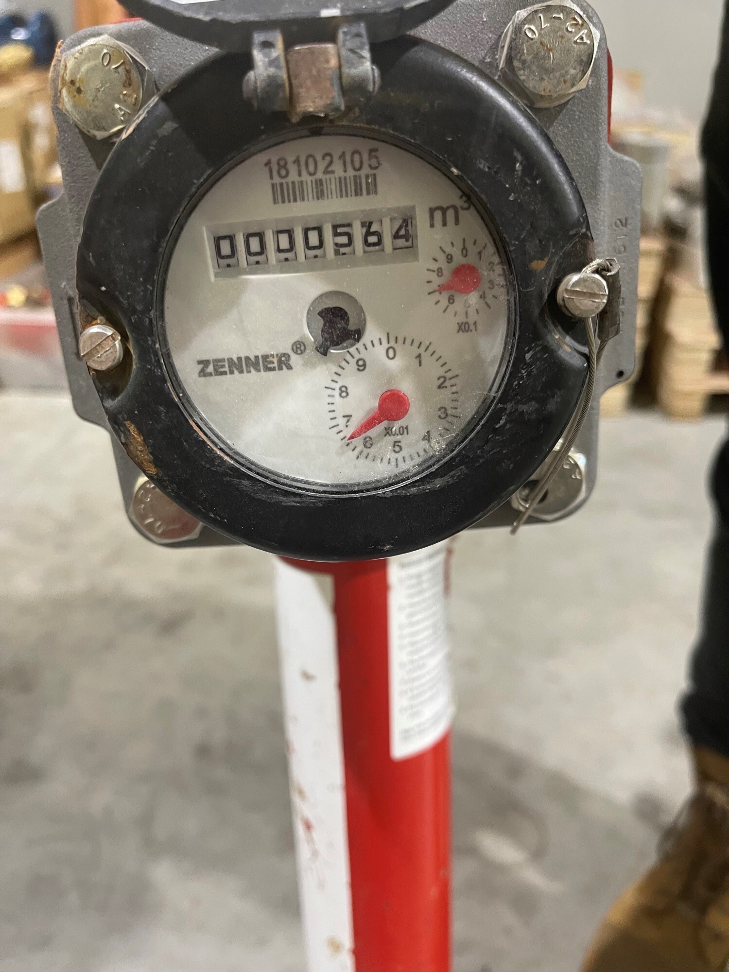 Image shows a meter with dials on in and a number which refers to how much water has flowed through the stand pipe