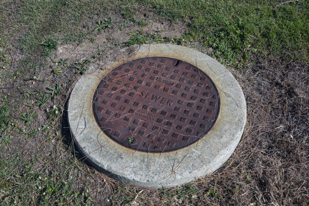 sewer manhole cover over cement shaft